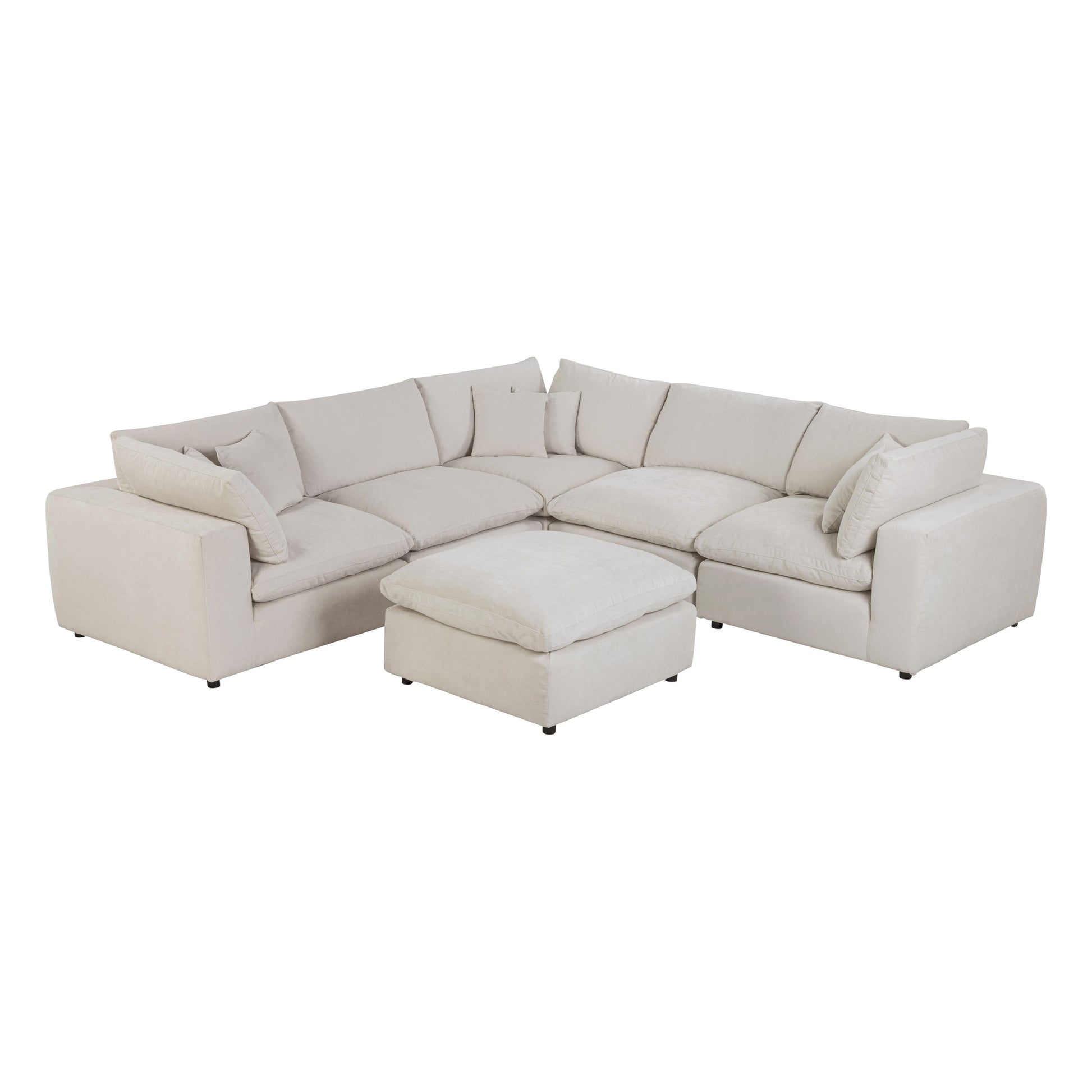 Alvora modular sofa in Ivory arranged with a matching ottoman