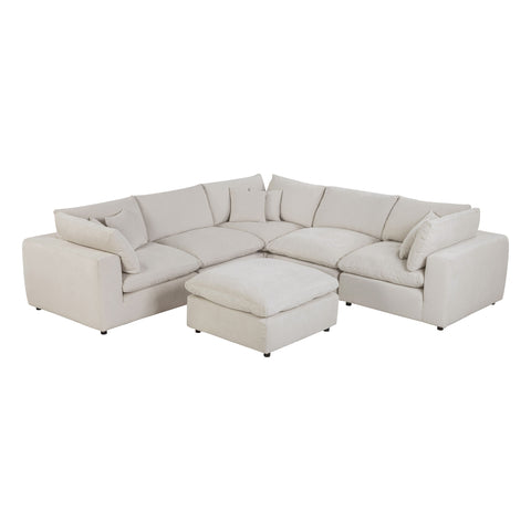Alvora modular sofa in Ivory arranged with a matching ottoman